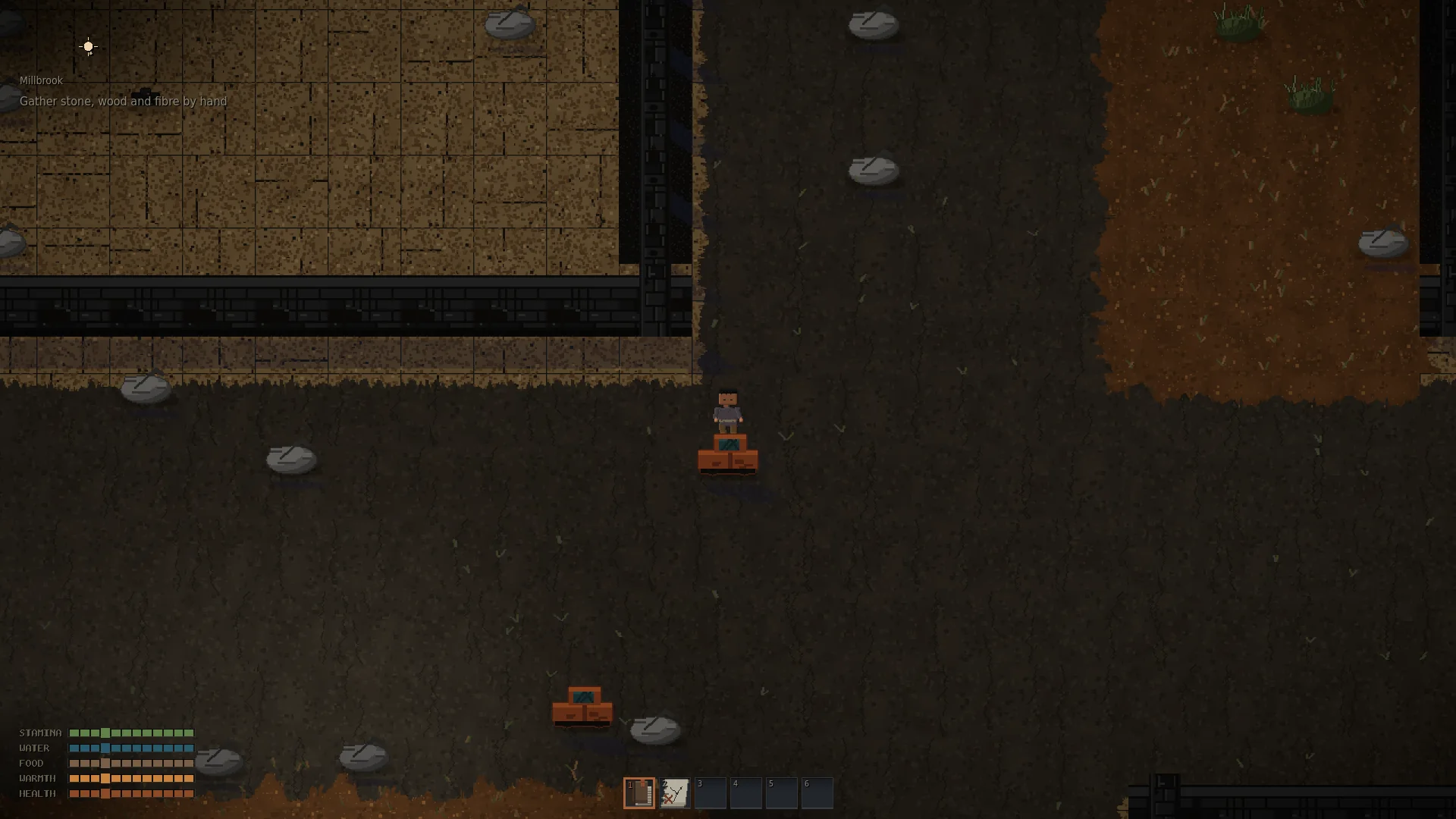 A lit interior room in the settlement of Millbrook, seen from above.